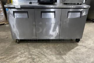 True TWT-72 stainless steel 3-door worktop refrigerator, Energy Star certified, upturned backsplash, on casters, model TWT72.