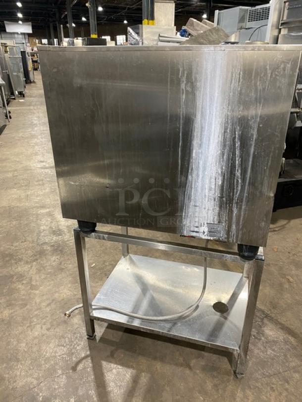 Rational SCC61 stainless steel commercial combi convection oven on undershelf stand. Natural gas powered, 208V 3 phase.