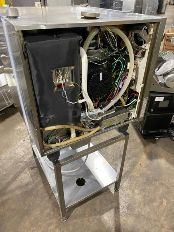 Rational SCC61 stainless steel natural gas combi convection oven, with undershelf stand and wired oven rack, shown in exposed condition.