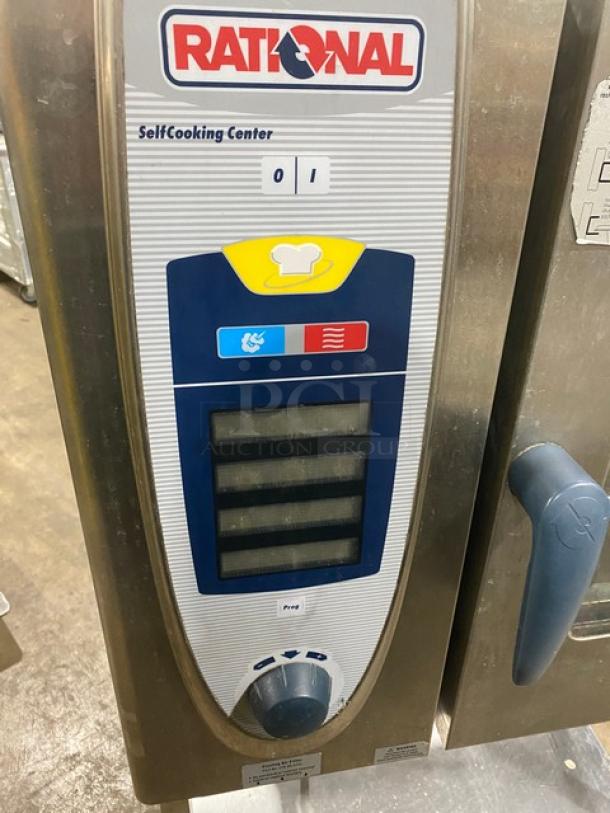 Rational Stainless Steel SCC61 Combi Convection Oven; gas powered; 208V 3 Phase; includes undershelf stand and wired rack.