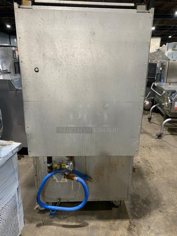 Blodgett stainless steel 4-burner range/deck oven combo, model B36C-XX, on casters. Features undercounter storage, backsplash.