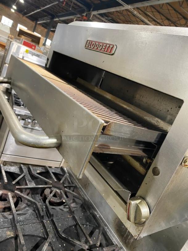 Blodgett B36C-XX commercial stainless steel 4-burner range and deck oven combo, natural gas, with backsplash and undercounter storage, on casters.