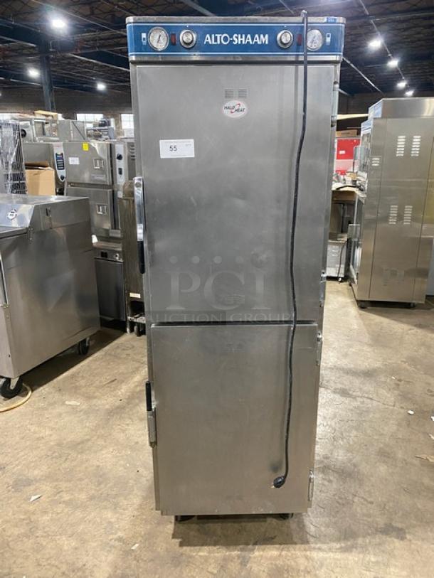 Alto-Shaam 1200-UP stainless steel dual-compartment heated holding cabinet on casters. Features individual compartment control and built-in universal rack. Model: 1200-UP SN: 171396-1101, 208-240V 1 Phase.