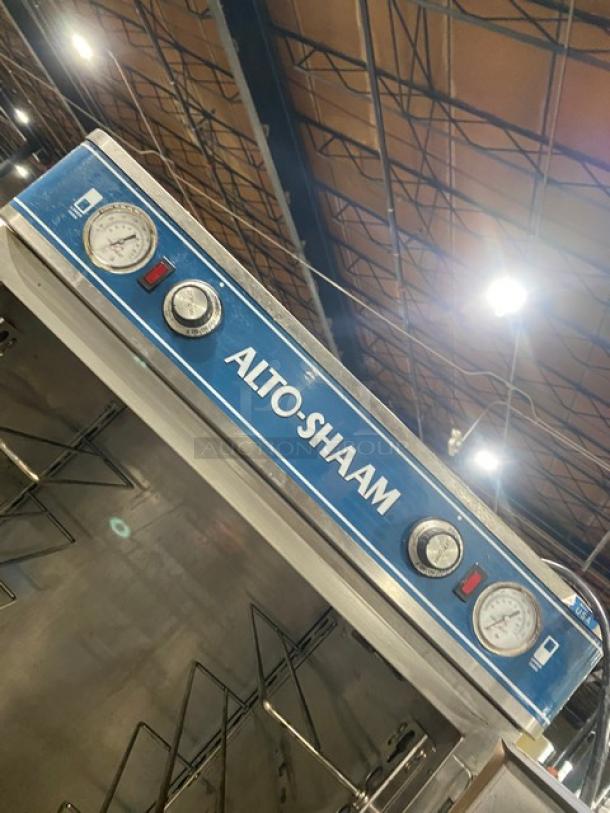 Alto-Shaam 1200-UP stainless steel heated cabinet with dual compartments, individual controls, universal rack, on casters.