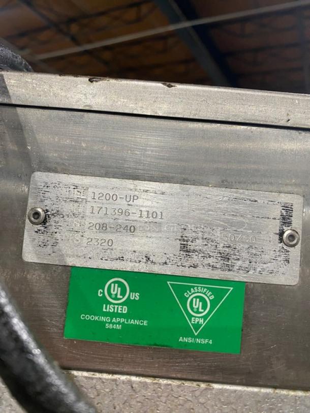 Alto-Shaam 1200-UP stainless steel heated cabinet, model 1200UP, serial number 171396-1101, 208-240V, on casters with UL certification.