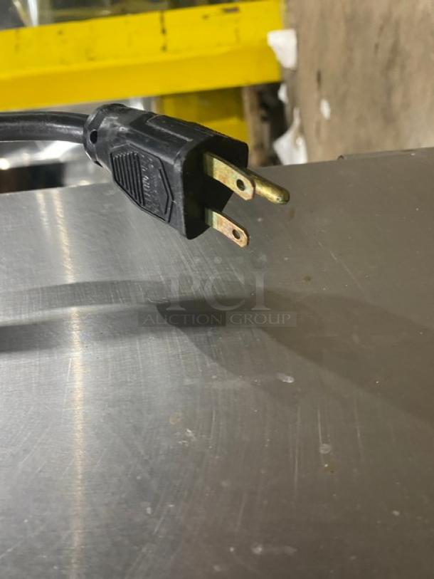 Alto-Shaam stainless steel Dutch door heated cabinet plug and top surface. Model 1200UP. Dual-compartment on casters.