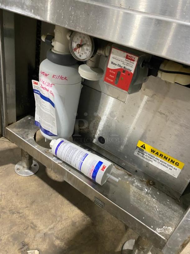 Market Forge ETP10G dual compartment steamer, stainless steel, natural gas, 10-pan capacity, Energy Star certified, model ETP-10G, SN: 83935-8GG-3673, visible water filter system.