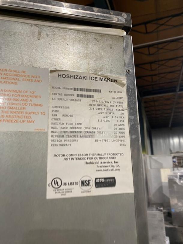 Hoshizaki KM901MRH ice maker/bin combo, stainless steel, remote-cooled, cresent cube style, model tag showing specs.