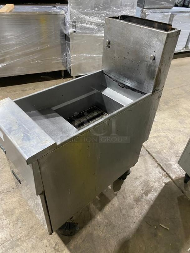 Pitco SG14S stainless steel 40 lb. deep fat fryer, natural gas powered, with backsplash and casters. Serial: G16FD051768.