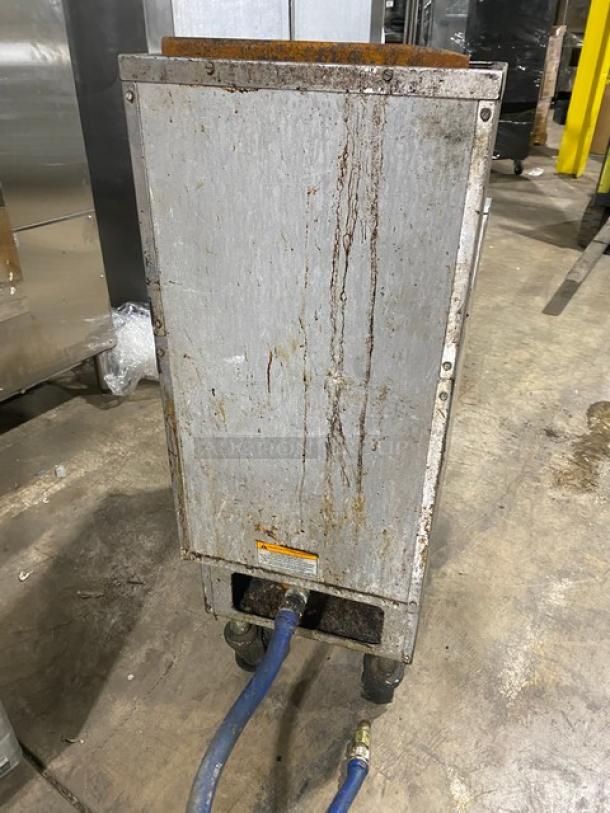 Pitco SG14-S natural gas 40 lb fryer, stainless steel, back splash, on casters. Shows wear and rust on exterior.