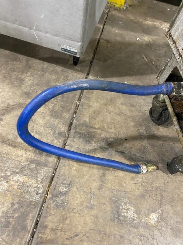 Pitco SG14S commercial deep fat fryer on casters, showing gas hose connection. Stainless steel, suitable for natural gas.