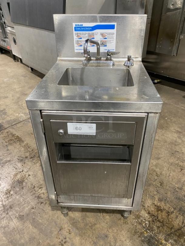Ecolab stainless steel hand washing station with swivel faucet, soap and towel dispensers, backsplash, and legs.