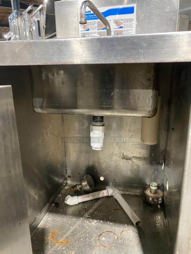 Ecolab stainless steel hand washing station with swivel faucet, soap & towel dispenser, and backsplash, shown with plumbing parts.