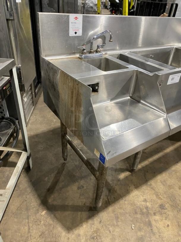 Commercial stainless steel cocktail station with backsplash, integrated dump sink, swivel faucet, ice bin, speed rail, on legs.