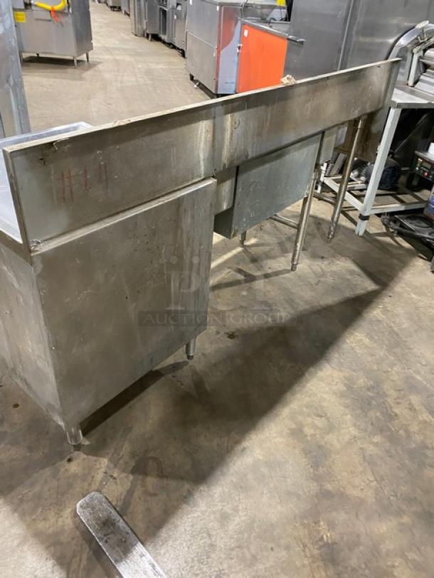 Commercial stainless steel cocktail station with backsplash, integrated dump sink, swivel faucet, ice bin, speed rail, on legs.