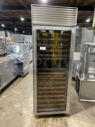 Sub-Zero model 430 stainless steel wine cooler, glass swing door, commercial-grade, multiple wooden racks, good condition.