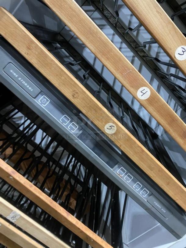 Sub-Zero Model 430 wine cooler with glass door, wood racks. Features control panel. Labels on racks numbered 3 to 5.