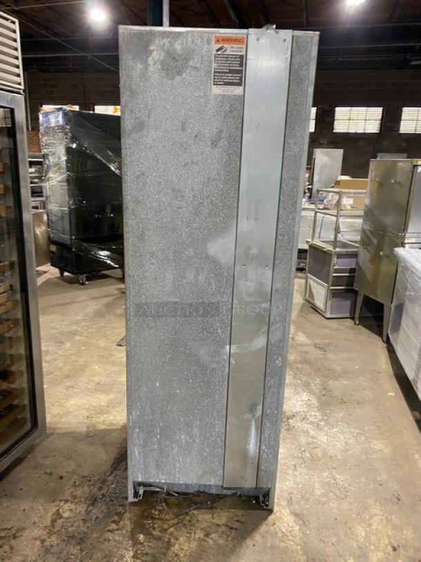 Sub-Zero 427R stainless steel wine cooler with single glass swing door, 2-drawer storage base; commercial-grade, minor wear.