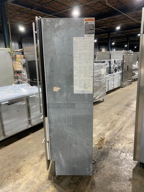 Sub-Zero Model 427R stainless steel wine cooler with glass swing door, two drawer storage base, model tag visible, good condition.