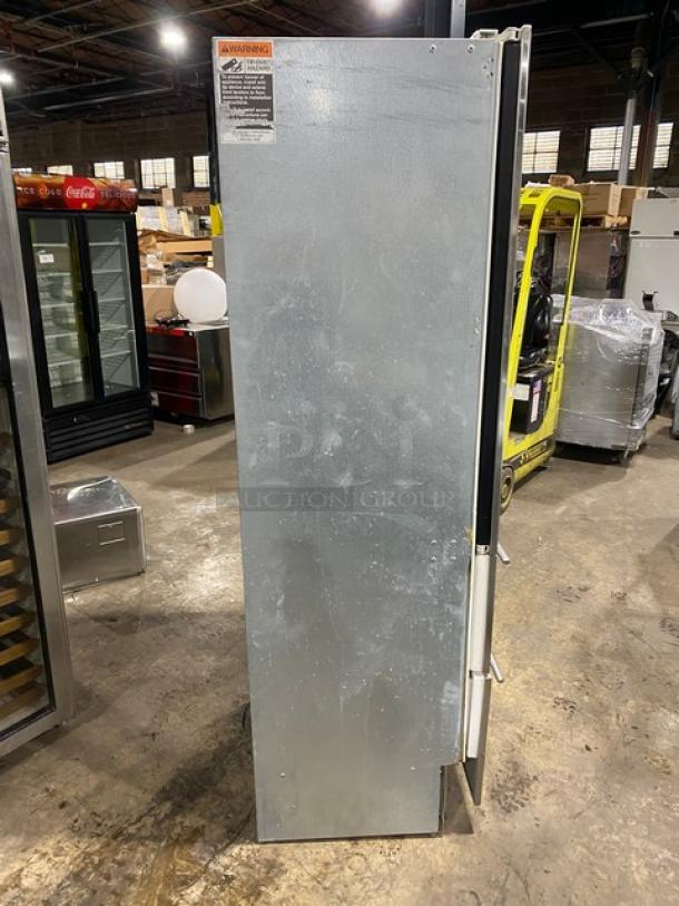 Sub-Zero commercial stainless steel glass door wine storage cooler, model 427R, with two-drawer base. Light wear visible.