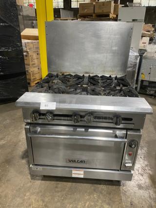 Vulcan V6B36S stainless steel 6-burner natural gas range/oven with backsplash, wired rack; model SN: 481963683, on legs.