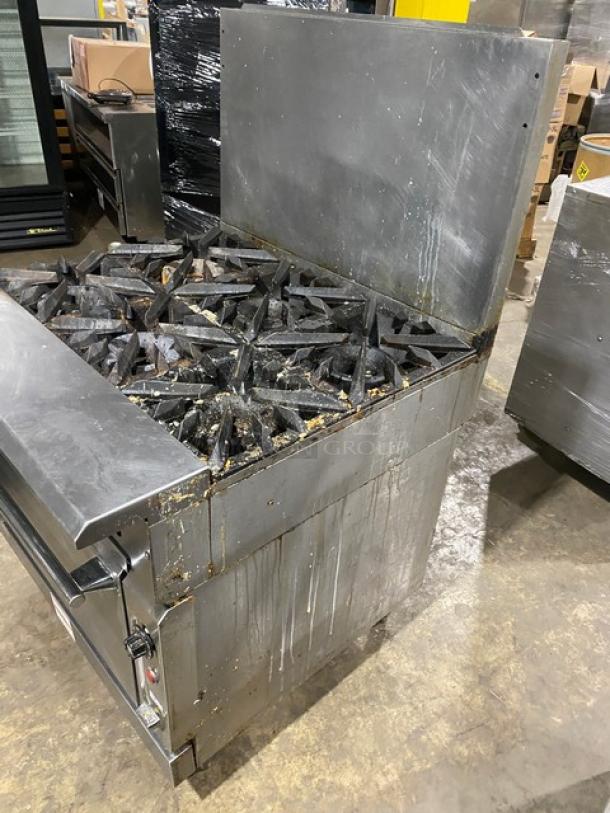 Vulcan V6B36S commercial stainless steel 6-burner range/oven combo, natural gas, with backsplash, wired oven rack, on legs.