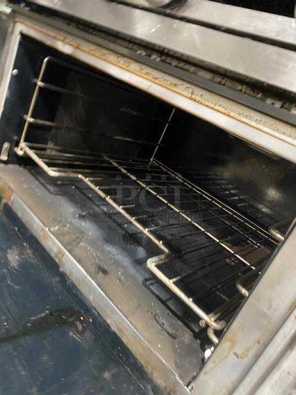 Vulcan V6B36S 6-burner stainless steel gas range/oven, 2016 model, with backsplash and wired oven rack, on legs.