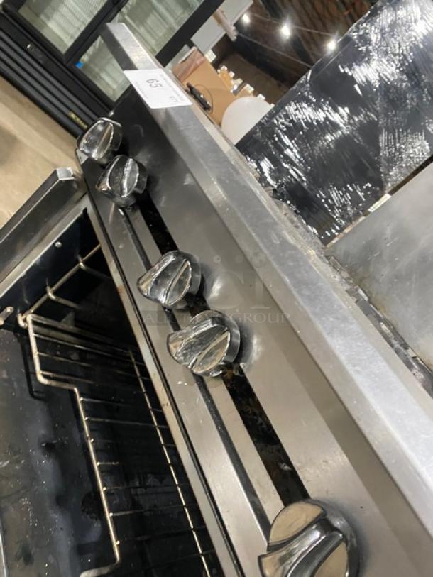 Vulcan V6B36S stainless steel 6-burner gas range/oven combo, featuring wired oven rack and backsplash. Model: V6B36S.