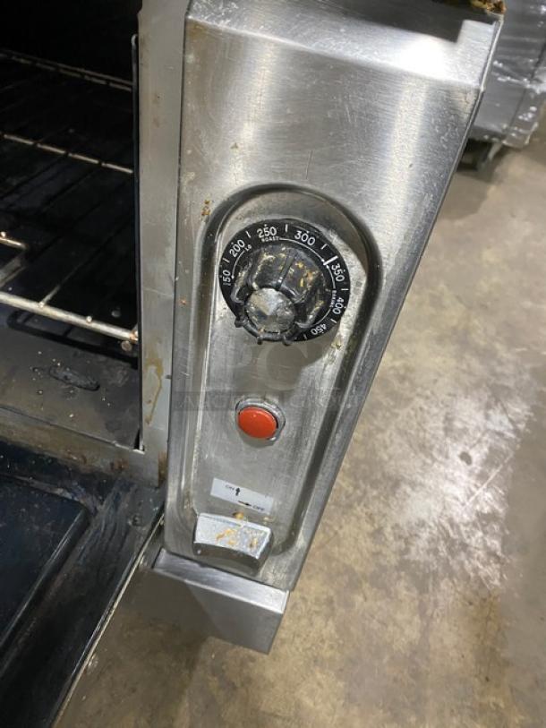 Vulcan V6B36S range/oven, 6 burners, stainless steel, natural gas, adjustable dial, shows wear, on legs, includes rack.