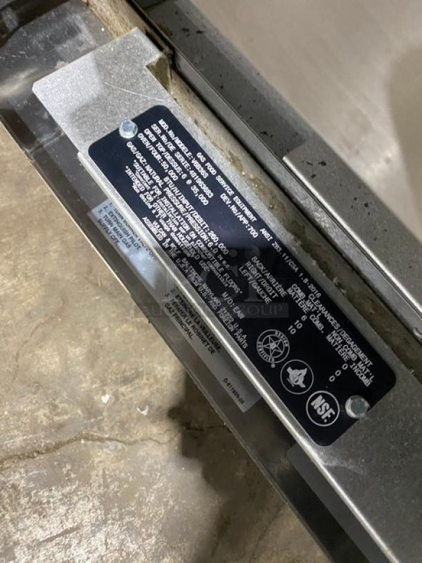 Vulcan V6B36S stainless steel 6-burner range/oven, natural gas, with backsplash, wired oven rack, on legs, model tag visible.