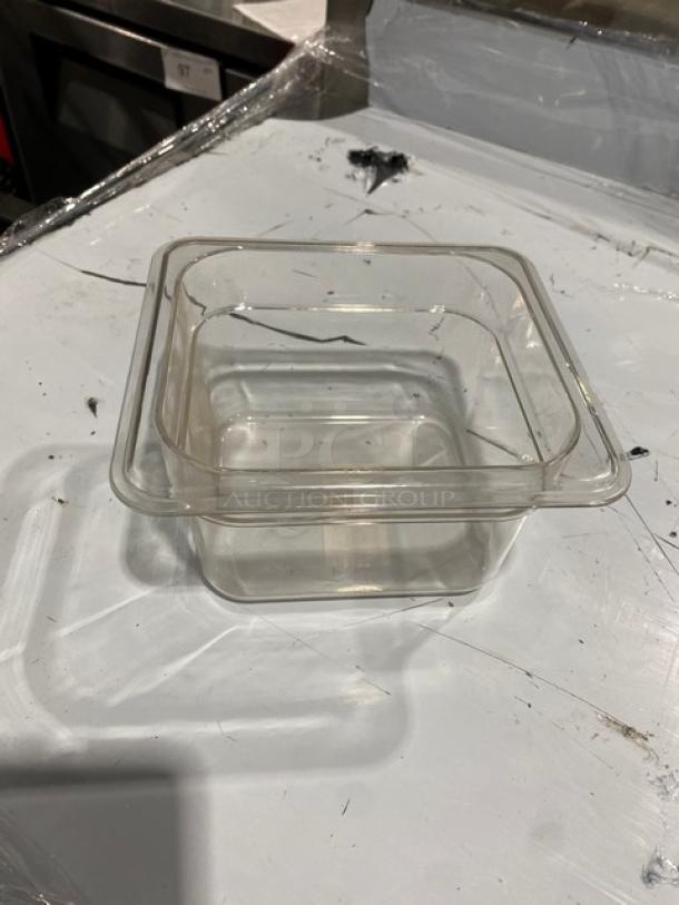 Winco SP7604 clear polycarbonate food pan, 1/6-size, 4" deep, new condition, ideal for commercial use.