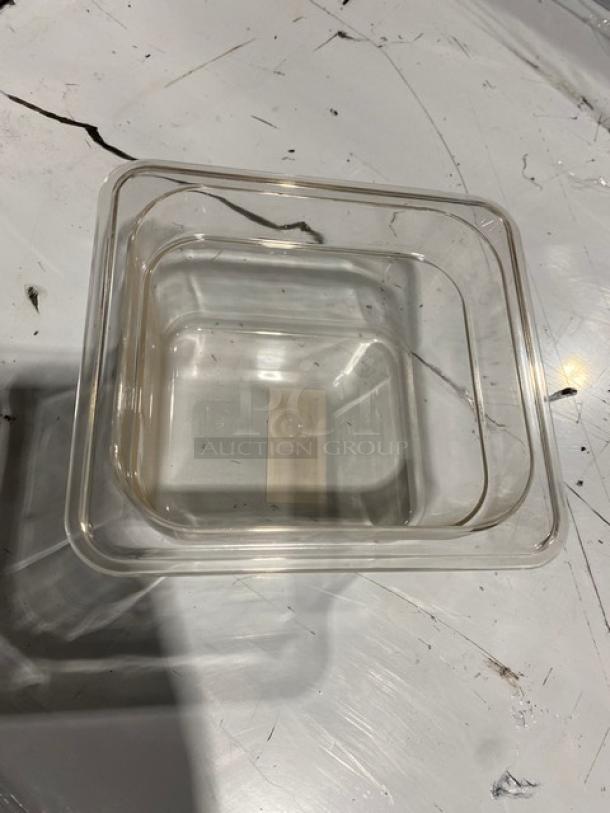 Winco SP7604 clear polycarbonate food pan, 1/6-size, 4" deep. New condition, durable design ideal for commercial use.