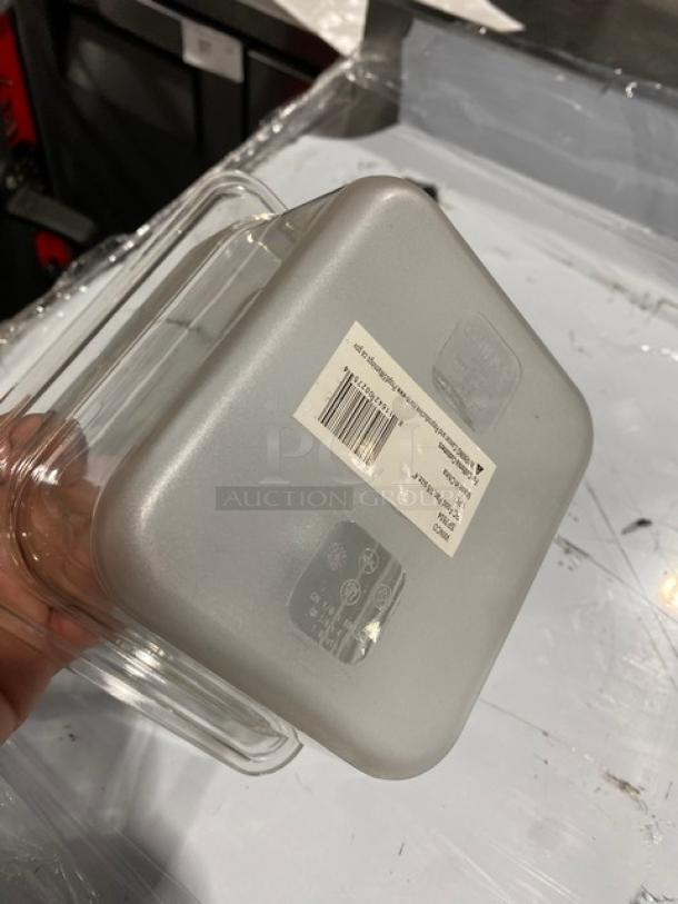 Winco SP7604 clear polycarbonate food pan, 1/6-size, 4" deep, new condition. Visible label with barcode and product details.