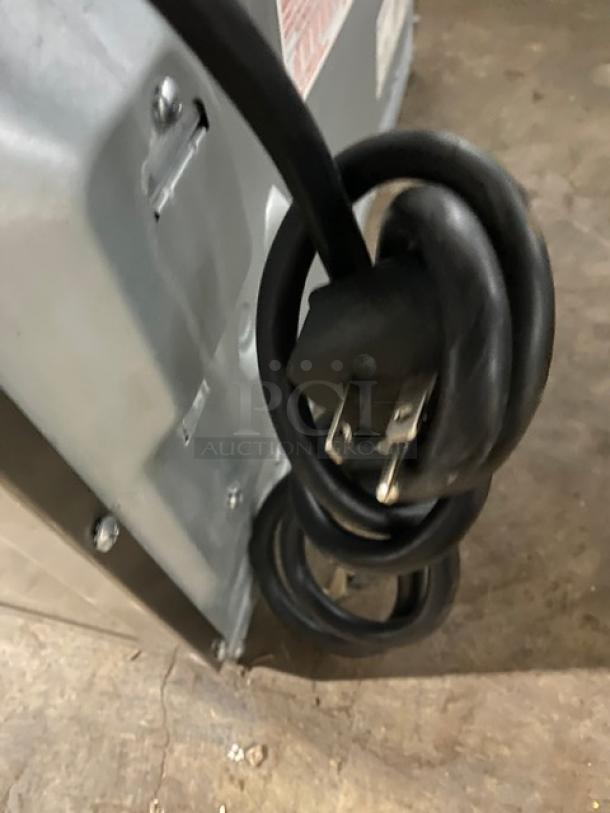 Menumaster RFS12TSW commercial countertop microwave, stainless steel, 120V, digital push button, visible power cord.