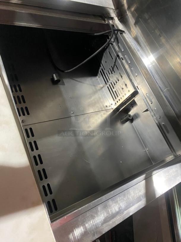 Turbo Air Super Deluxe 2 Door Prep Table, stainless steel interior, includes cutting board and chrome rack, Model TST60SD24N.