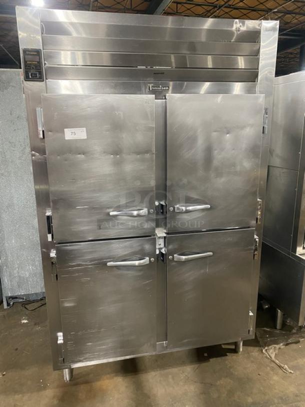 Traulsen stainless steel 4-door 2-section reach-in refrigerator, model AHT232NUT, with pan slide, on legs.