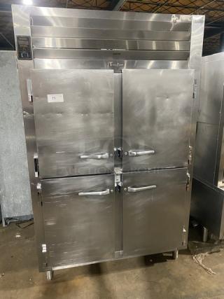 Traulsen stainless steel 4-door 2-section reach-in refrigerator, model AHT232NUT, with pan slide, on legs.