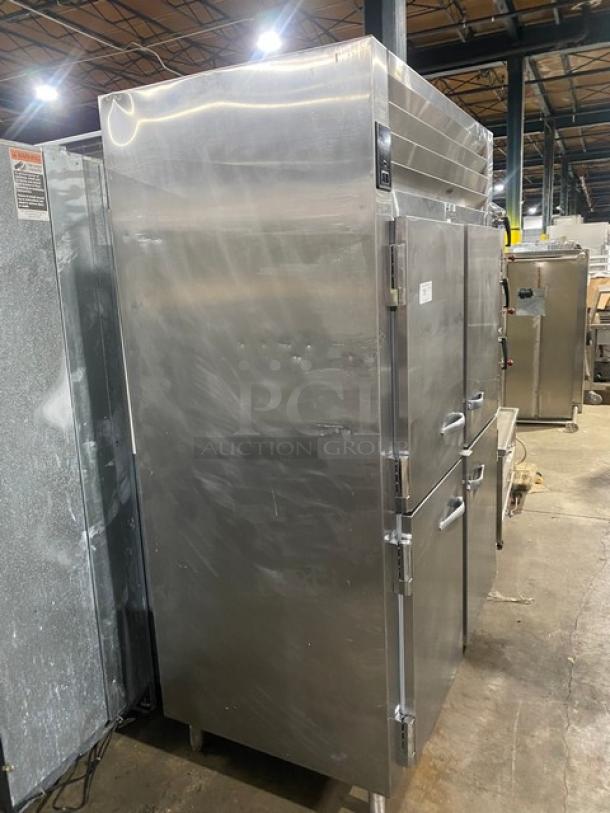 Traulsen stainless steel 4-door reach-in fridge, model AHT2-32NUT. Includes built-in pan slide, 115V, on legs.