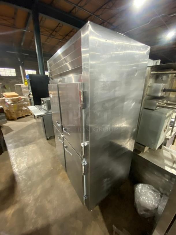 Traulsen 4-Door 2-Section Reach-In Refrigerator, Model AHT232NUT, stainless steel, with built-in pan slide, on legs. 