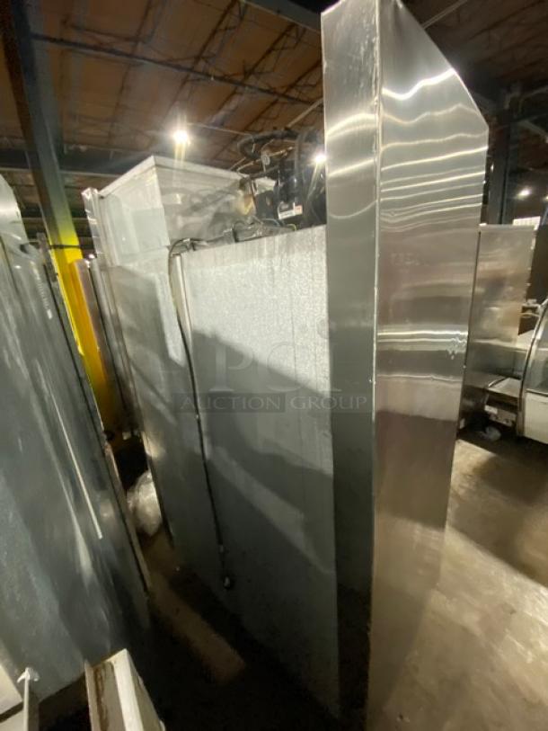 Traulsen stainless steel 4-door reach-in refrigerator, model AHT232NUT, with pan slide, 115V, on legs.