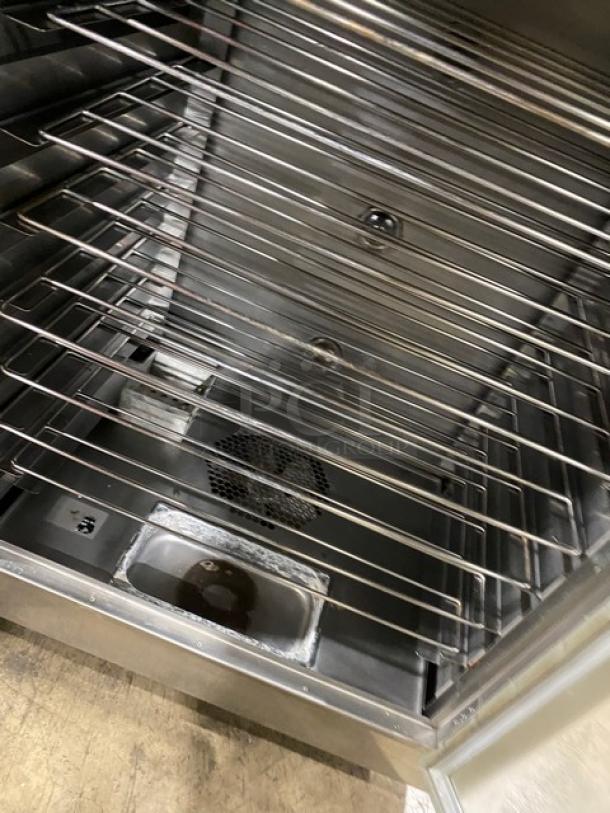 Nu-Vu SUB123 double deck oven/proofer combo, stainless steel, with wired racks, 208V 3-phase, on casters.