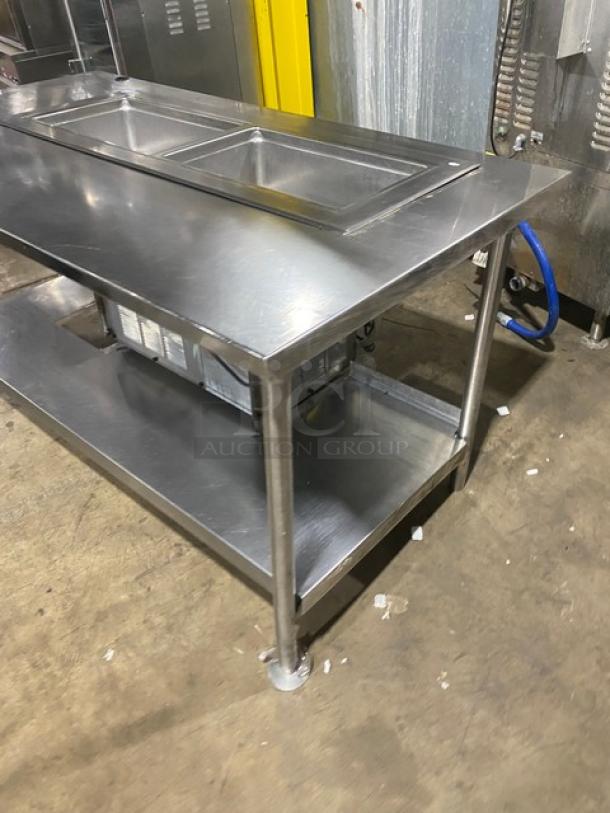 Delfield 8148EFNP stainless steel electric refrigerated 2-well drop-in cold food table with single undershelf, on legs.