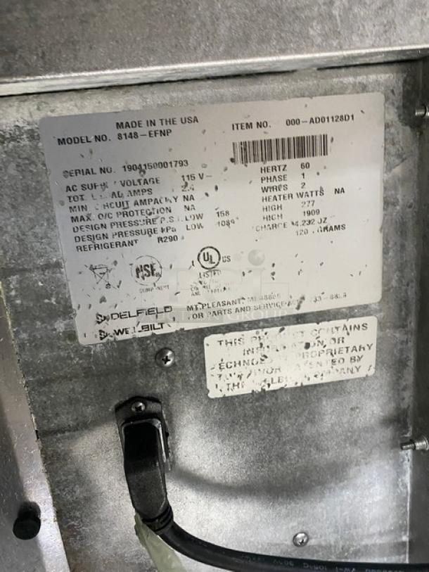 Delfield 8148EFNP refrigerated drop-in food table, stainless steel, 2-well, model details and specs on label.