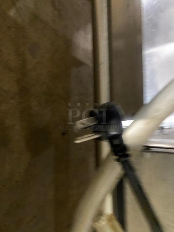 Delfield Model 8148EFNP plug and power cord on stainless steel refrigerated cold food table. 115V, electric powered.