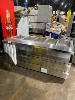 Delfield stainless steel 4-drawer refrigerated salad bar, model 18MC68PEF, with 5-well top, enclosed undershelf, on casters.