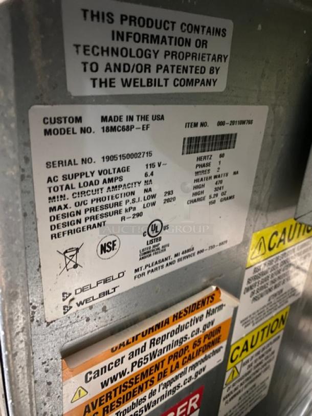 Delfield 18MC68PEF label with specs: 115V, 1 phase, 5.4 amps. NSF and UL listed. Includes safety and refrigerant info.
