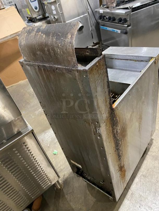 Frymaster GF40 stainless steel natural gas fryer with backsplash, basket hanger, on casters; visible wear and rust.