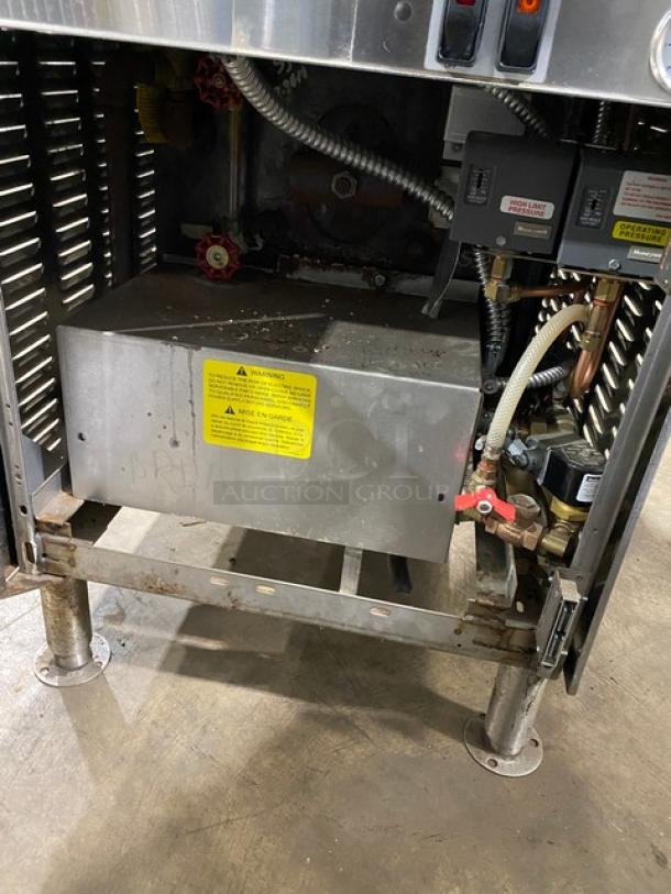 Cleveland Range Classic Series 24CEM24 stainless steel dual-compartment electric steamer with boiler base, on legs, 208/220V, 3-phase.