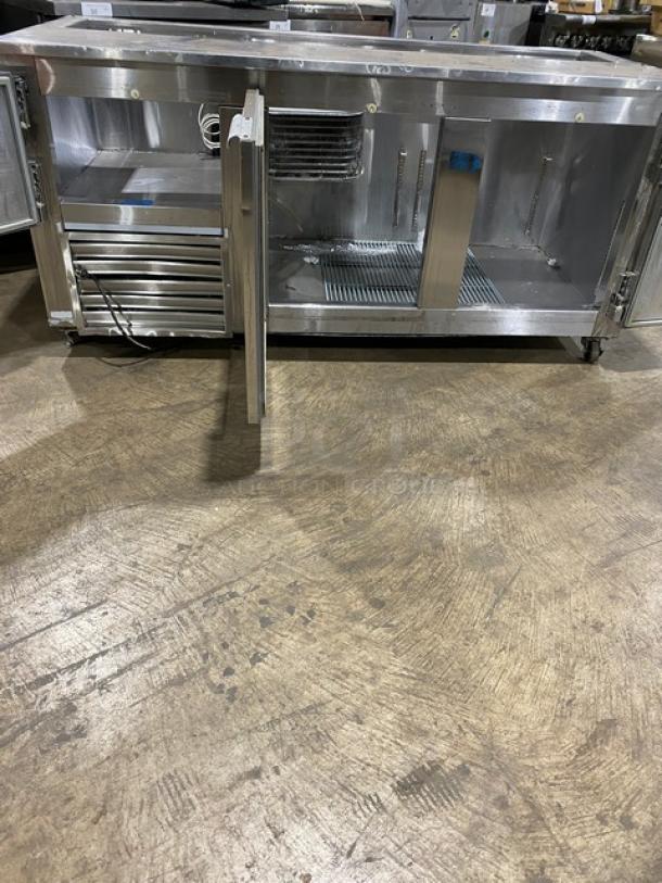 Leader Commercial Stainless Steel 3 Door Refrigerated Salad/Sandwich Prep Table, features poly coated wired rack, on casters.