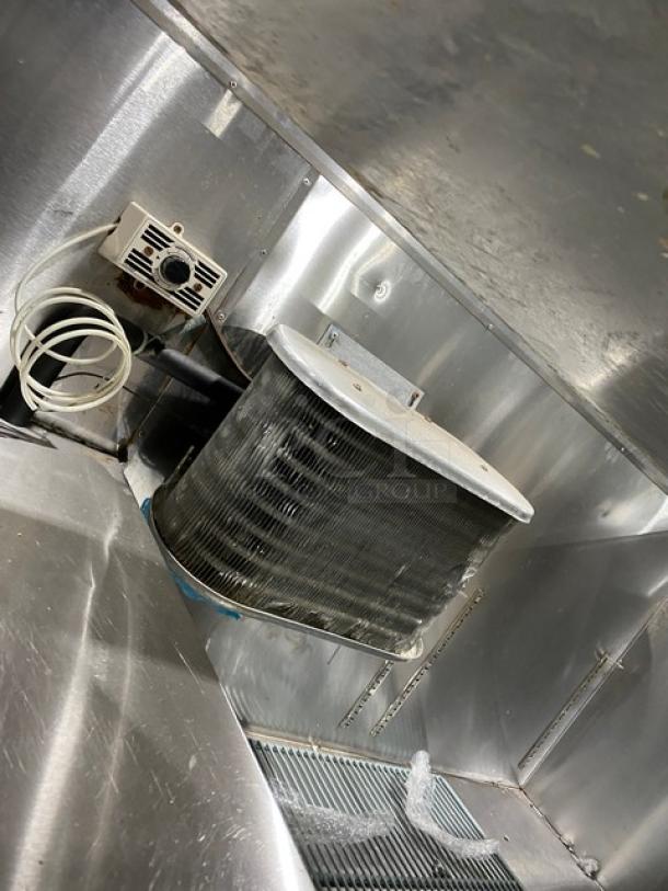 Leader stainless steel refrigerated prep table interior with wiring and cooling element. Features poly coated rack.